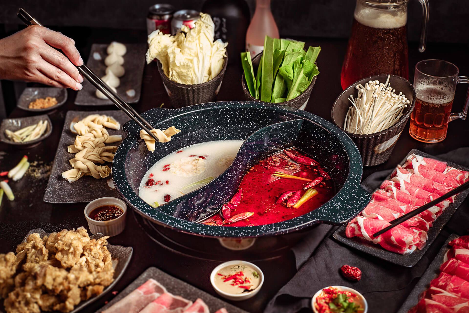 Hot pot spread styled and lit for a restaurant film
